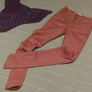 High waisted pink skinny jeans.